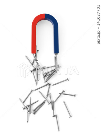 Horseshoe magnet attracting nails on white background, top view Horseshoe magnet attracting nails on white background, top view 141027701