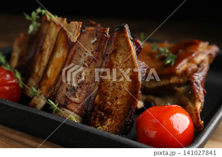 Delicious roasted ribs served in pan, closeup 141027841