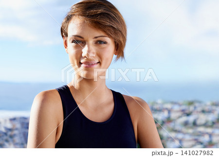 Outdoor, portrait or happy woman with smile for running workout, fitness exercise or healthy wellness. Athlete, proud runner or female sports person ready to start training with confidence in city Outdoor, portrait or happy woman with smile for running workout, fitness exercise or healthy wellness. Athlete, proud runner or female sports person ready to start training with confidence in city 141027982