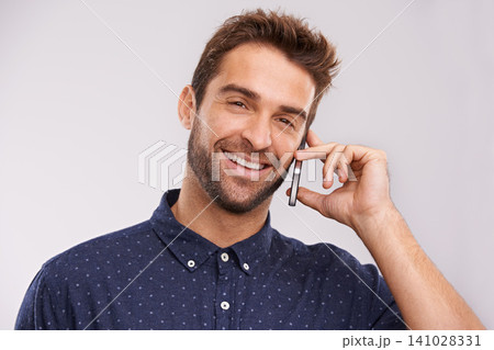 Networking, communication and portrait of phone call with man in studio, background and mockup. Happy, businessman and contact on smartphone with news, feedback of information or announcement in chat 141028331