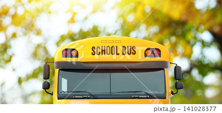 Yellow school bus outdoors, closeup. Transport for students 141028377