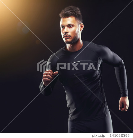 Exercise, athlete and runner man in studio for sprint workout, marathon or competition with black background. Sport, lens flare and male model person for speed, endurance training and wellness Exercise, athlete and runner man in studio for sprint workout, marathon or competition with black background. Sport, lens flare and male model person for speed, endurance training and wellness 141028593