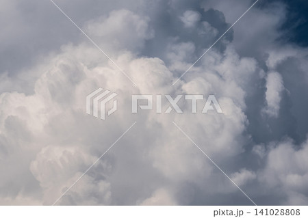 White cumulus clouds in a blue summer sky White cumulus clouds in a blue summer sky 141028808
