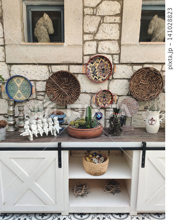 Rustic wall decor with wicker plates and ceramic ornaments in Turkey Rustic wall decor with wicker plates and ceramic ornaments in Turkey 141028823