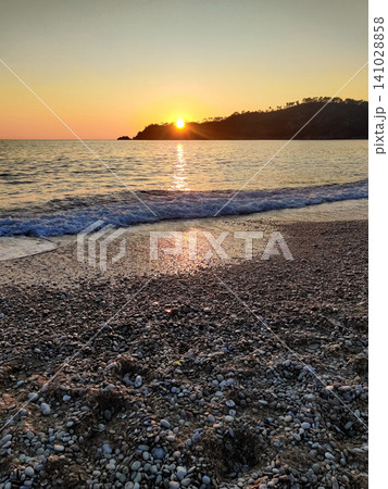 beautiful dramatic landscape of sunset on the sea beach beautiful dramatic landscape of sunset on the sea beach 141028858