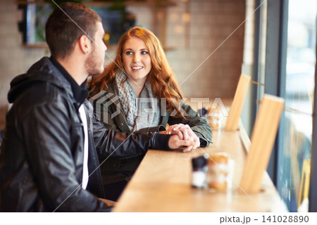 Couple, smile and holding hands in cafe with love, romance and affection on anniversary date. Romantic, man and woman in restaurant bonding, happy and support in relationship for dating people 141028890