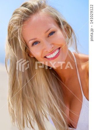 Woman, portrait and outdoor beach, travel and breeze for ocean holiday or summer vacation. Happy female person, wind and smile for weekend trip on sand, closeup and confidence in outdoor nature Woman, portrait and outdoor beach, travel and breeze for ocean holiday or summer vacation. Happy female person, wind and smile for weekend trip on sand, closeup and confidence in outdoor nature 141029122