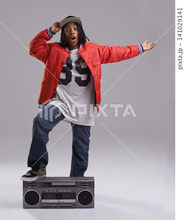 Black child, wow and portrait with radio for hip hop, rap and swag dance with cool clothes in studio. Smile, teen clothing and boombox with urban style and fashion and kid with grey background Black child, wow and portrait with radio for hip hop, rap and swag dance with cool clothes in studio. Smile, teen clothing and boombox with urban style and fashion and kid with grey background 141029141