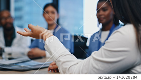 Team, meeting and hands of doctors in discussion for planning, surgery update and diagnosis in boardroom. Medicine, medical group and people talking in clinic office for solution and collaboration 141029284