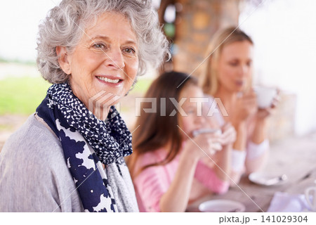 Portrait, grandma or mama to relax, child or family by drinking tea, happy or bonding together. Female pensioner, woman or girl at table in retirement garden in multigenerational coffee hangout Portrait, grandma or mama to relax, child or family by drinking tea, happy or bonding together. Female pensioner, woman or girl at table in retirement garden in multigenerational coffee hangout 141029304