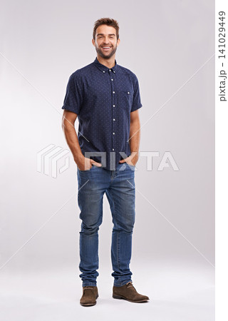 Casual, fashion and portrait of businessman in studio, background and mockup with confidence. Happy, man and relax in jeans with pride or creative person in business as art director or entrepreneur Casual, fashion and portrait of businessman in studio, background and mockup with confidence. Happy, man and relax in jeans with pride or creative person in business as art director or entrepreneur 141029449