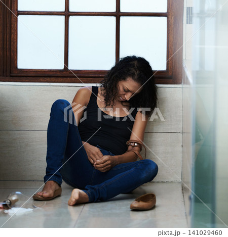 Woman, drug addict and overdose in bathroom for addiction or withdrawal symptoms, depression and mental health. Person or user, relapse and belt for heroin or substance abuse for feeling of euphoria Woman, drug addict and overdose in bathroom for addiction or withdrawal symptoms, depression and mental health. Person or user, relapse and belt for heroin or substance abuse for feeling of euphoria 141029460