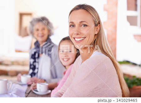 Portrait, mother and daughter to grandmother, generations and smile for visit at retirement home. Adult, girl and woman with coffee, outdoor and table in backyard for picnic, family and love Portrait, mother and daughter to grandmother, generations and smile for visit at retirement home. Adult, girl and woman with coffee, outdoor and table in backyard for picnic, family and love 141029465