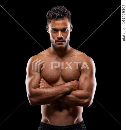 Gym, portrait and man in studio with muscle, confidence and workout routine in health, wellness and power. Serious face, pride and strong athlete on black background for exercise, results and care Gym, portrait and man in studio with muscle, confidence and workout routine in health, wellness and power. Serious face, pride and strong athlete on black background for exercise, results and care 141029508
