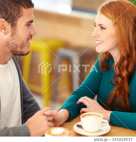Restaurant, date and couple with coffee, holding hands and relationship with romance and flirt. Cafe, man and woman with cappuccino or bonding together with care or love with marriage, smile or trust Restaurant, date and couple with coffee, holding hands and relationship with romance and flirt. Cafe, man and woman with cappuccino or bonding together with care or love with marriage, smile or trust 141029537