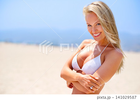 Woman, beach and portrait on sand vacation, travel and calm satisfaction for peace and ocean. Happy female person, smile and bikini for holiday to sea on weekend, nature and relax on tropical island Woman, beach and portrait on sand vacation, travel and calm satisfaction for peace and ocean. Happy female person, smile and bikini for holiday to sea on weekend, nature and relax on tropical island 141029587