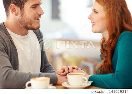 Couple, bonding and touch of hands in cafe, support and happiness for peace in relationship. Adult, woman and girl with man or partner with hand in coffee shop, smile and joy for marriage with guy Couple, bonding and touch of hands in cafe, support and happiness for peace in relationship. Adult, woman and girl with man or partner with hand in coffee shop, smile and joy for marriage with guy 141029814