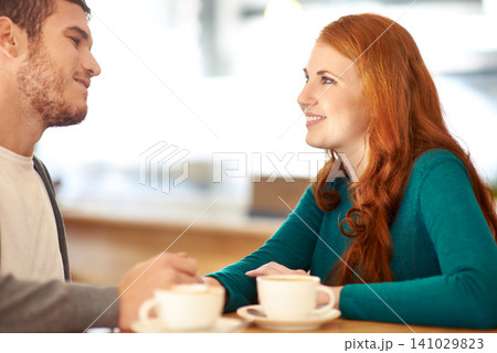 Couple, smile and eye contact for love in coffee shop, support and happiness for peace in relationship. Adult, woman and girl together with man or partner in cafe, excited and marriage with guy 141029823