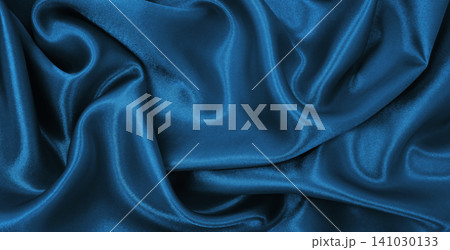 Smooth elegant blue silk or satin luxury texture as abstract background. Luxurious Christmas background or New Year background design 141030133