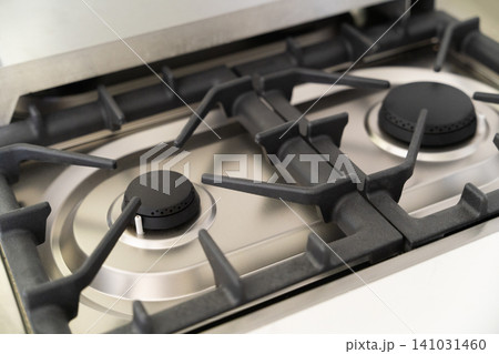 Close-up of a modern stainless steel gas stove top Close-up of a modern stainless steel gas stove top 141031460
