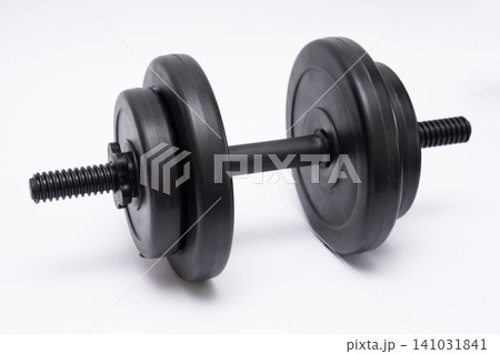Adjustable black dumbbell for weightlifting on white background Adjustable black dumbbell for weightlifting on white background 141031841