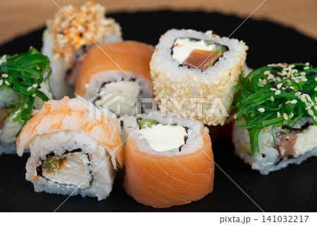 delicious traditional Japanese sushi and rolls on a plate delicious traditional Japanese sushi and rolls on a plate 141032217