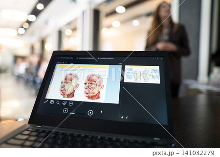Medical training presentation on facial muscles on a laptop Medical training presentation on facial muscles on a laptop 141032279