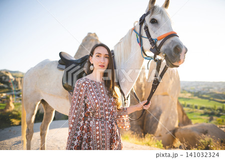 beautiful girl outdoors in the mountains with her faithful horse beautiful girl outdoors in the mountains with her faithful horse 141032324