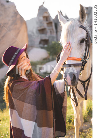 beautiful girl outdoors in the mountains with her faithful horse beautiful girl outdoors in the mountains with her faithful horse 141032335