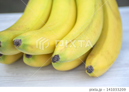 Ripe yellow bananas offering a healthy, natural, and sweet snack, representing fresh fruit, nutritious food, and tropical goodness for a balanced diet Ripe yellow bananas offering a healthy, natural, and sweet snack, representing fresh fruit, nutritious food, and tropical goodness for a balanced diet 141033209