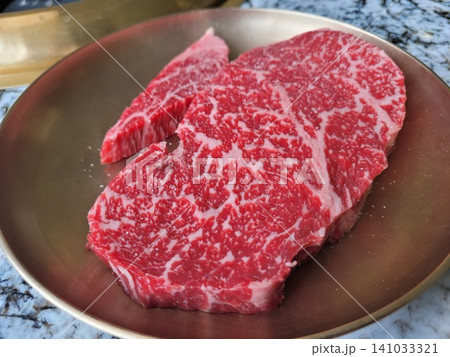 Premium Korean Native Beef Hanwoo Ribeye Steak on Brass Plate Premium Korean Native Beef Hanwoo Ribeye Steak on Brass Plate 141033321