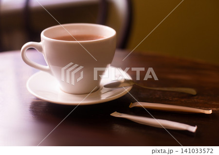 a cup of fragrant coffee in a restaurant on the table a cup of fragrant coffee in a restaurant on the table 141033572