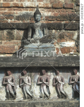 Title Ancient Buddha statue and stone reliefs at Wat Mahathat in Sukhothai Thailand Title Ancient Buddha statue and stone reliefs at Wat Mahathat in Sukhothai Thailand 141033627