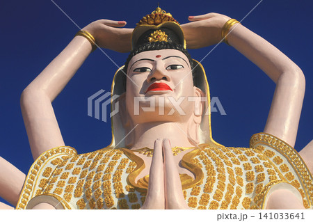 Close-up face of the giant Guanyin statue at Wat Plai Laem on Koh Samui Close-up face of the giant Guanyin statue at Wat Plai Laem on Koh Samui 141033641