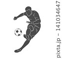 Football soccer player man in action kicks a ball isolated white background 141034647