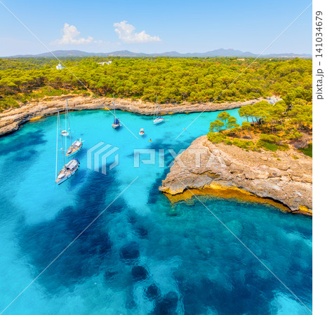 Aerial drone view of yachts and boats in a sea bay in Mallorca, Spain.  141034679