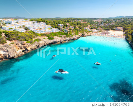 Aerial view of sandy beach, sea bay, boats in Mallorca, Spain Aerial view of sandy beach, sea bay, boats in Mallorca, Spain 141034763