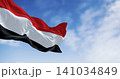 Yemen national flags waving on a clear day 141034849