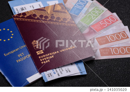 Sweden, swedish passport or id document with tickets for flight, travel. Swedish passport Sweden, swedish passport or id document with tickets for flight, travel. Swedish passport 141035020