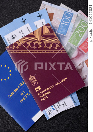 Sweden, swedish passport or id document with tickets for flight, travel. Swedish passport Sweden, swedish passport or id document with tickets for flight, travel. Swedish passport 141035021