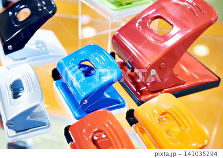 Punchers in office supply store 141035294