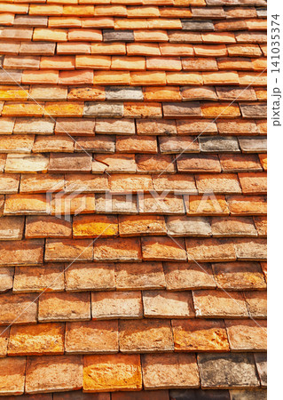 Weathered terracotta clay roof tiles Weathered terracotta clay roof tiles 141035374
