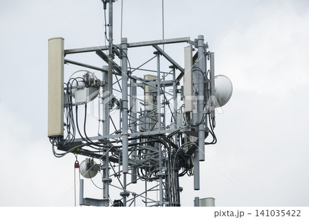 Corby, United Kingdom – July 25, 2026: Cellular communication tower with antennas and wireless network equipment, editorial Corby, United Kingdom – July 25, 2026: Cellular communication tower with antennas and wireless network equipment, editorial 141035422
