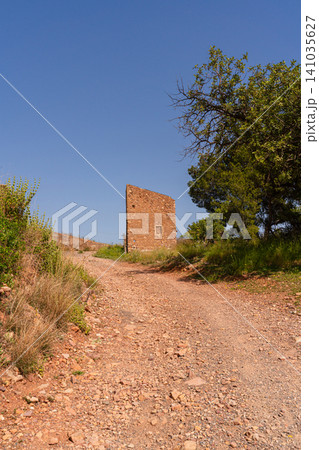 Ancient Stone Tower Ruins on Dirt Trail Near Vall dUixo Valencia Spain 141035627