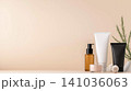 Skincare and cosmetics in minimalist setting with cream bottles and beauty products. 141036063