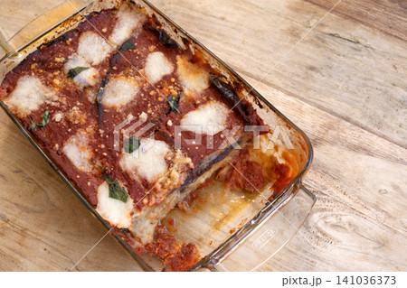 Eggplant parmigiana in glass baking dish Eggplant parmigiana in glass baking dish 141036373