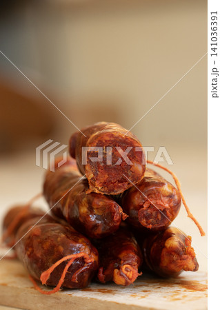 Calabrian Sausage Stacked on Wooden Board for Traditional Cuisine 141036391
