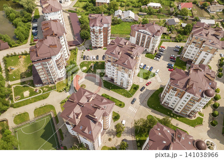 Top view of apartment or office tall buildings, parked cars, urban city landscape. Drone aerial photography. Top view of apartment or office tall buildings, parked cars, urban city landscape. Drone aerial photography. 141038966