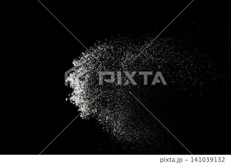 Fluffy White snow splash flying or throwing in mid air. Snowfall on Black background isolated. Snow dust element falling over dark night Fluffy White snow splash flying or throwing in mid air. Snowfall on Black background isolated. Snow dust element falling over dark night 141039132