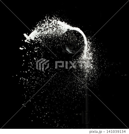 Fluffy White snow splash flying or throwing in mid air. Snowfall on Black background isolated. Snow dust element falling over dark night Fluffy White snow splash flying or throwing in mid air. Snowfall on Black background isolated. Snow dust element falling over dark night 141039134